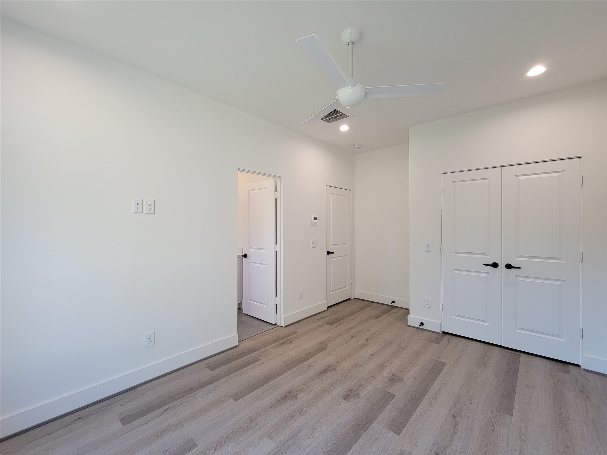 7705 Earl Rudder Way Houston, TX 77055 - Photo 6 of 39 a view of an empty room with wooden floor