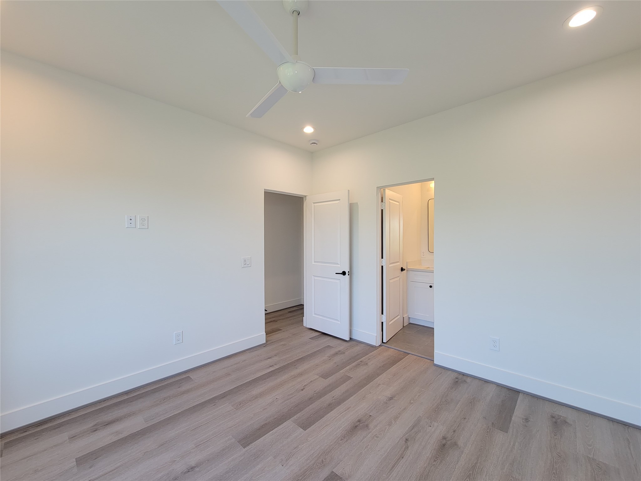 7705 Earl Rudder Way Houston, TX 77055 - Photo 10 of 39 a view of an empty room with wooden floor