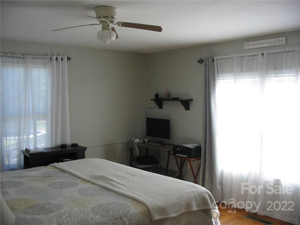 4366 Edgeland Road Edgemoor, SC 29712 - Photo 16 of 37 a bedroom with a bed and a window