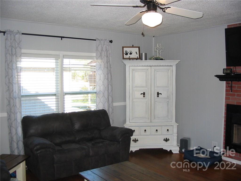 4366 Edgeland Road Edgemoor, SC 29712 - Photo 3 of 37 a living room with furniture and a flat screen tv