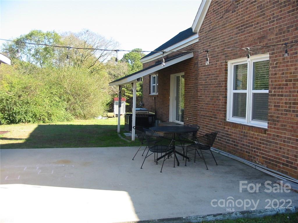 4366 Edgeland Road Edgemoor, SC 29712 - Photo 34 of 37 a backyard of a house with table and chairs