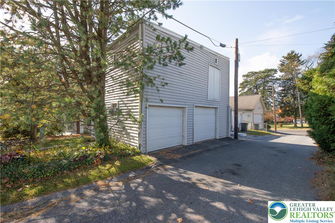 1130 Spring Street Bethlehem, PA 18018 - Photo 15 of 42 a view of a house with a yard and garage