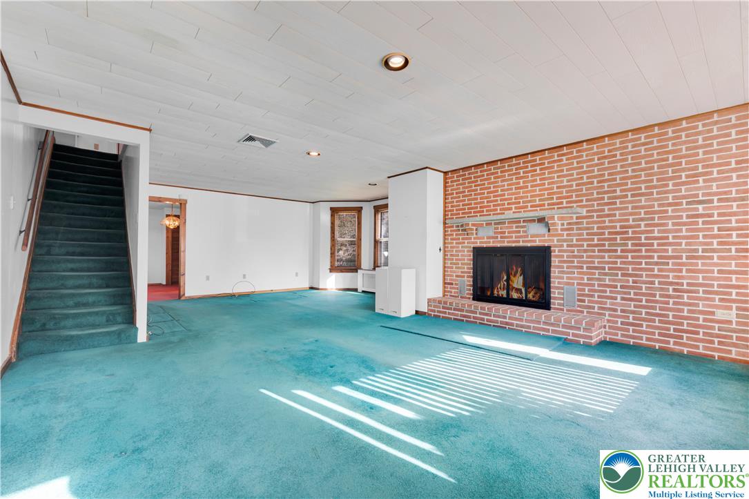1130 Spring Street Bethlehem, PA 18018 - Photo 17 of 42 a view of empty room with fireplace and fan