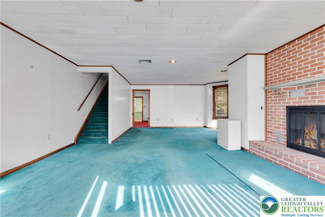 1130 Spring Street Bethlehem, PA 18018 - Photo 18 of 42 a view of an empty room with window and fireplace