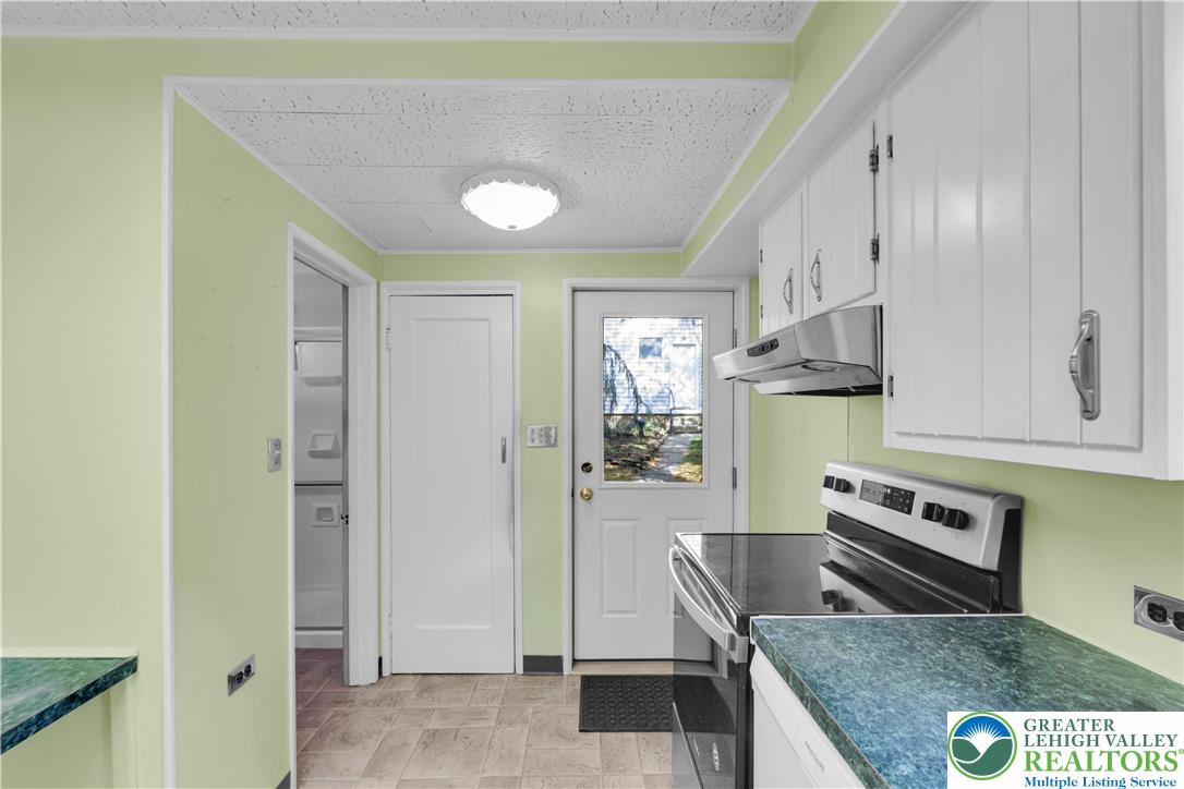 1130 Spring Street Bethlehem, PA 18018 - Photo 26 of 42 a kitchen with stainless steel appliances granite countertop a refrigerator and a stove top oven