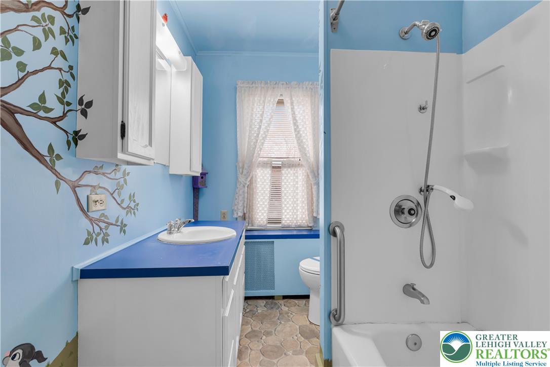 1130 Spring Street Bethlehem, PA 18018 - Photo 35 of 42 a bathroom with a granite countertop sink a toilet and shower