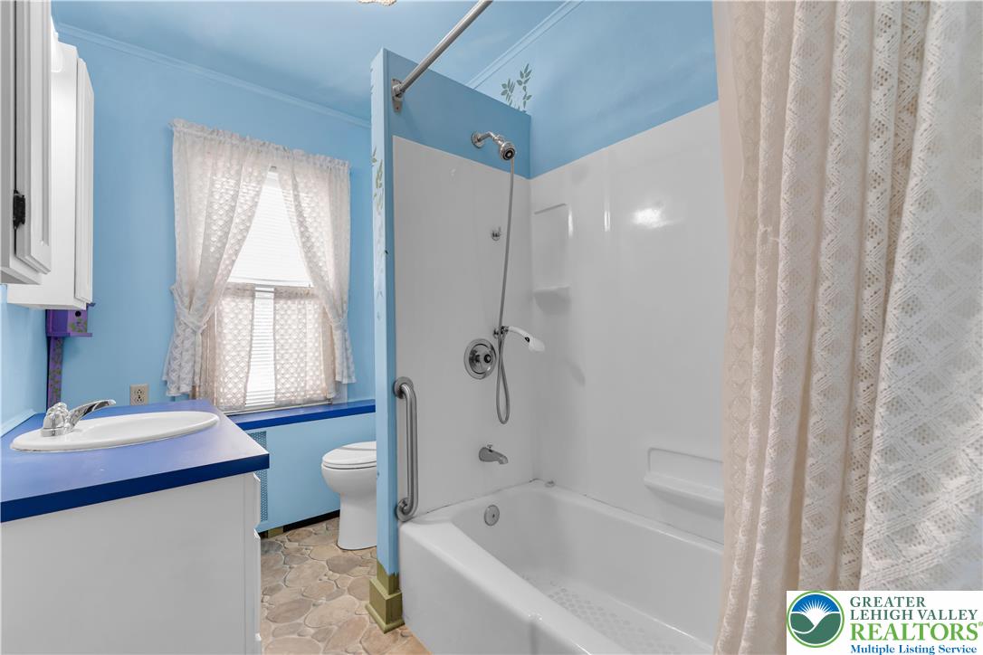 1130 Spring Street Bethlehem, PA 18018 - Photo 36 of 42 a bathroom with a tub sink and mirror