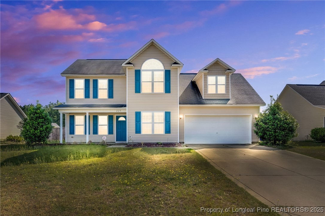229 Cape Fear Road Raeford, NC 28376 - Photo 1 of 46 a front view of a house with garden
