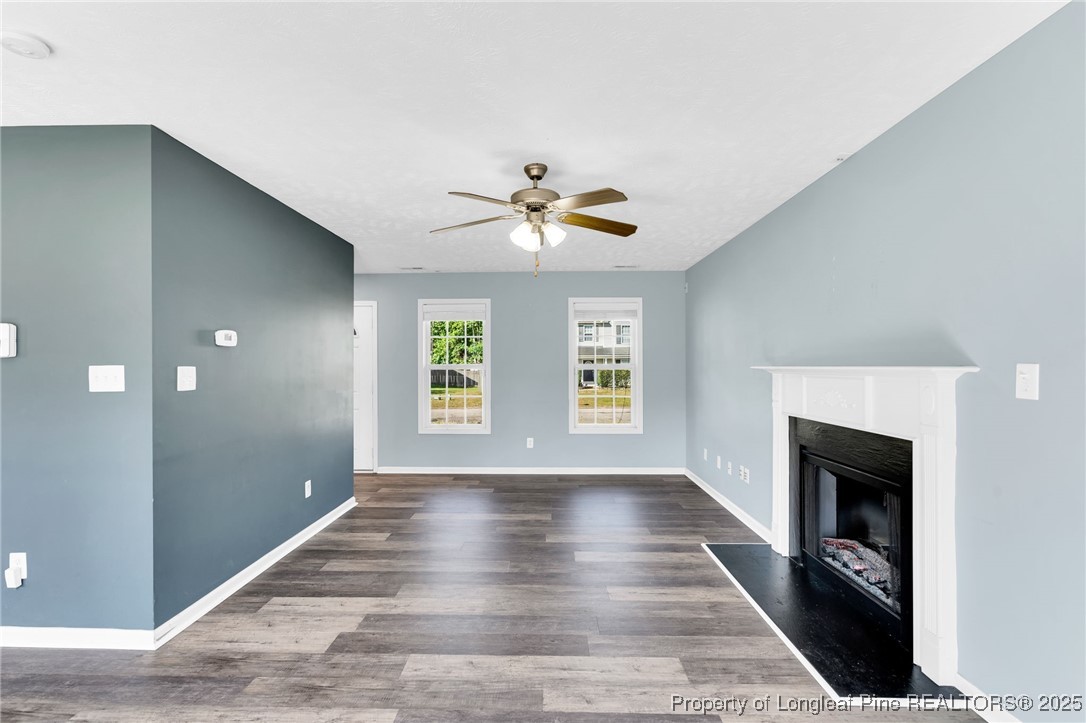 229 Cape Fear Road Raeford, NC 28376 - Photo 11 of 46 a view of an empty room with a window and a fireplace