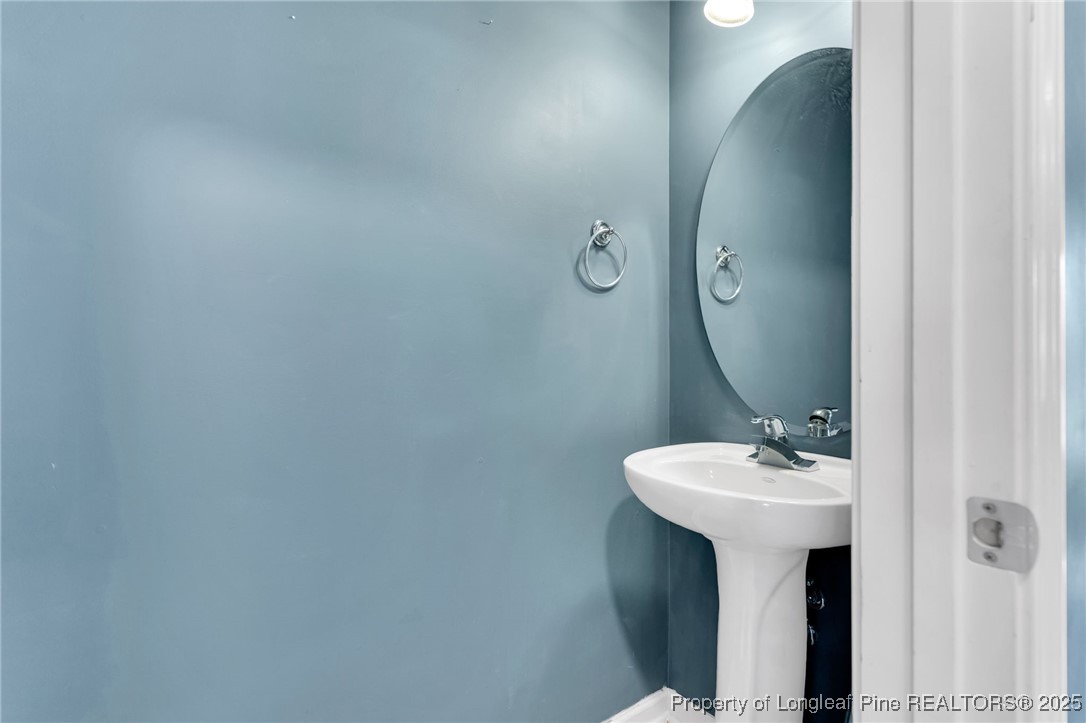 229 Cape Fear Road Raeford, NC 28376 - Photo 20 of 46 a bathroom with a sink and mirror
