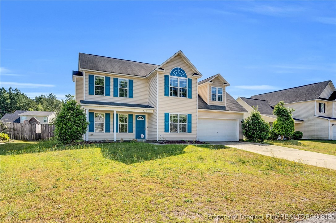 229 Cape Fear Road Raeford, NC 28376 - Photo 2 of 46 a front view of a house with a yard