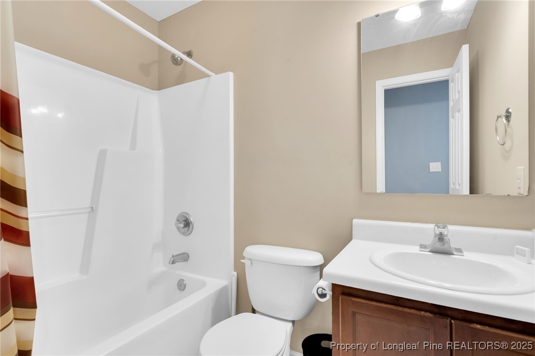 229 Cape Fear Road Raeford, NC 28376 - Photo 29 of 46 a bathroom with a sink toilet and shower