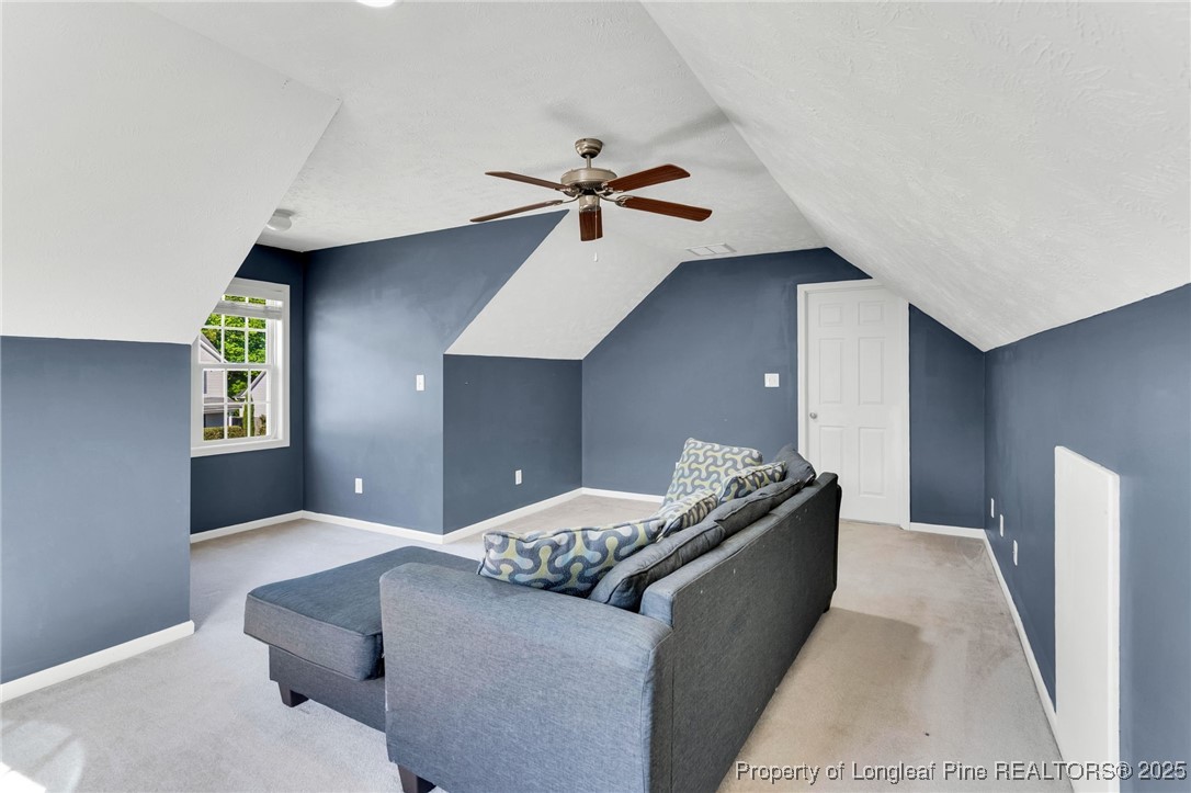 229 Cape Fear Road Raeford, NC 28376 - Photo 32 of 46 a living room with furniture and a ceiling fan