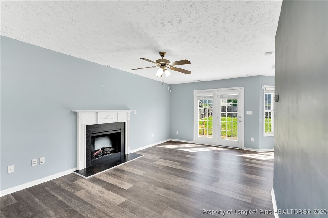 229 Cape Fear Road Raeford, NC 28376 - Photo 7 of 46 a view of an empty room with window and fireplace