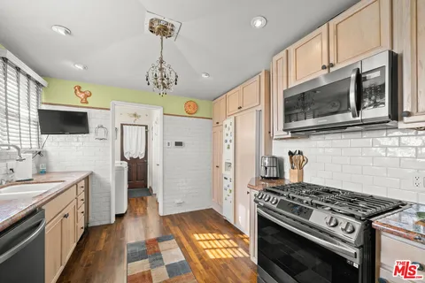 a bed room with a bed and a chandelier