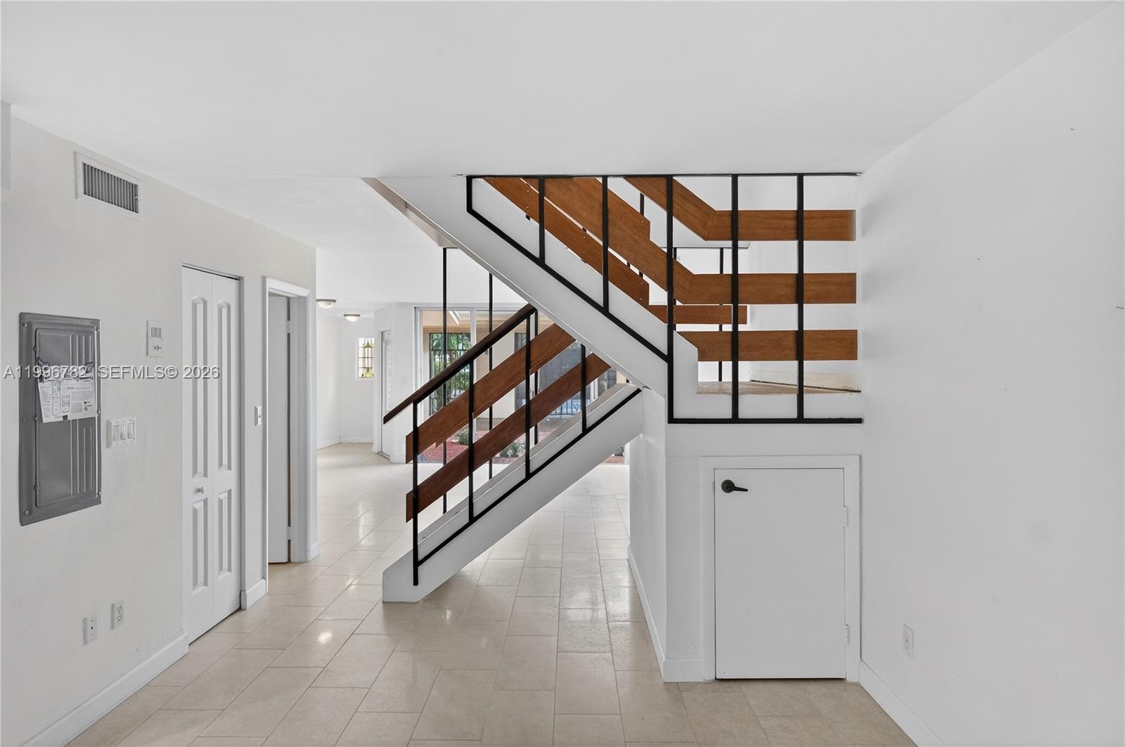 7833 Southwest 102nd Place Miami, FL 33173 - Photo 12 of 51 Stair case in the middle of first floor