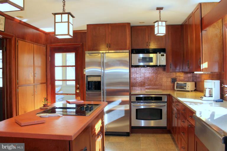 3046 Powder Mill Road Hyattsville, MD 20783 - Photo 10 of 20 a kitchen with a sink stove and microwave