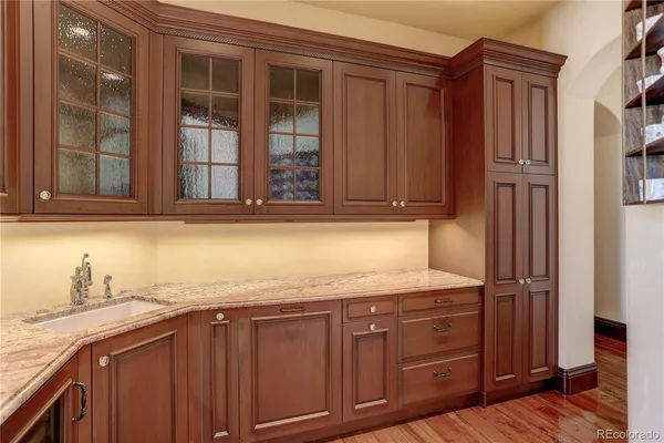 a kitchen with stainless steel appliances granite countertop cabinets and wooden floor