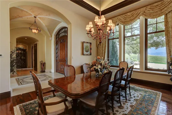a view of a dining room with furniture and window
