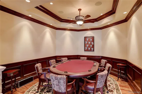 a view of a dining room with furniture and chandelier