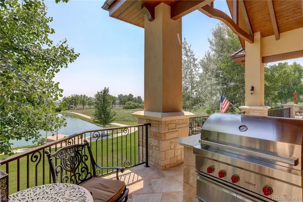 a view of a balcony with chairs