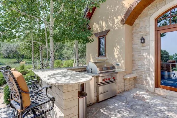 a view of a kitchen with outdoor seating area