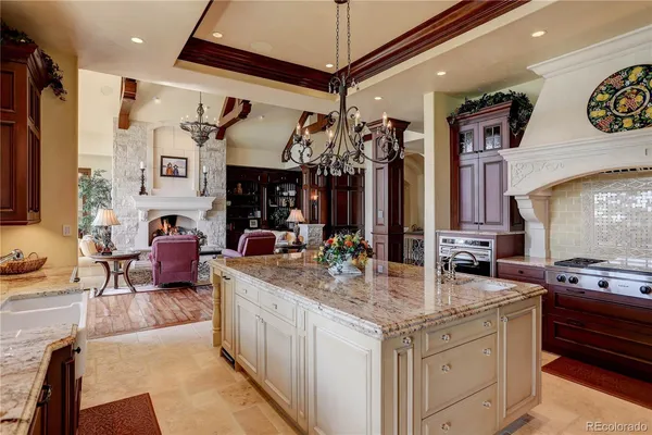a view of living room with granite countertop furniture and fireplace