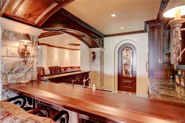 a view of a livingroom with furniture and staircase