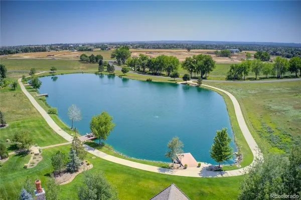 a view of a lake with a yard