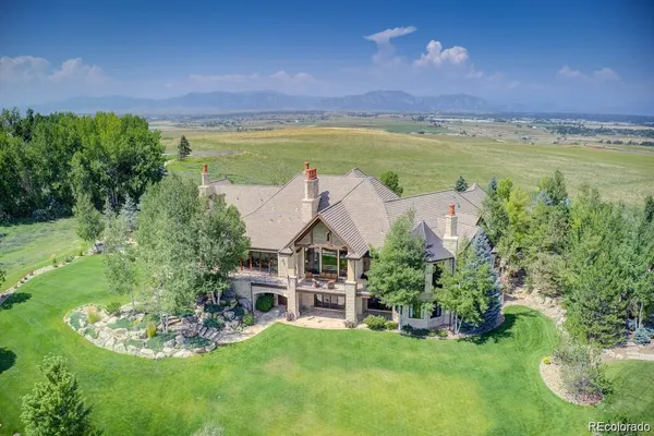 an aerial view of a house with a garden