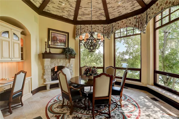 a view of a dining room with furniture window and outside view