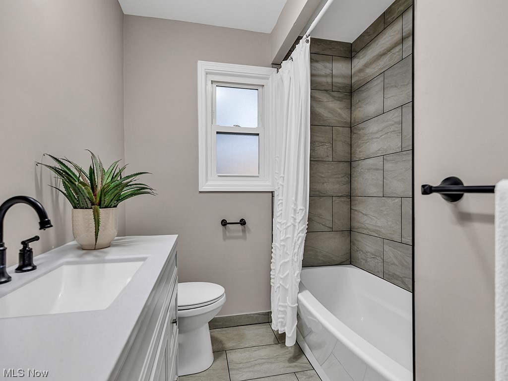1661 Rush Road Wickliffe, OH 44092 - Photo 9 of 26 Full bathroom featuring toilet, tile flooring, shower / bath combo, and vanity