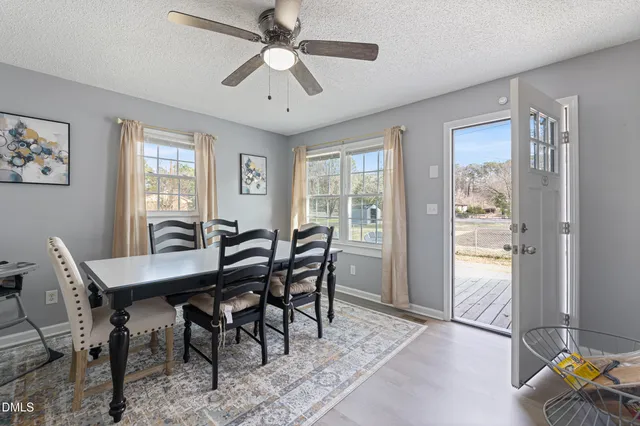 a view of a dining room with furniture window and outside view