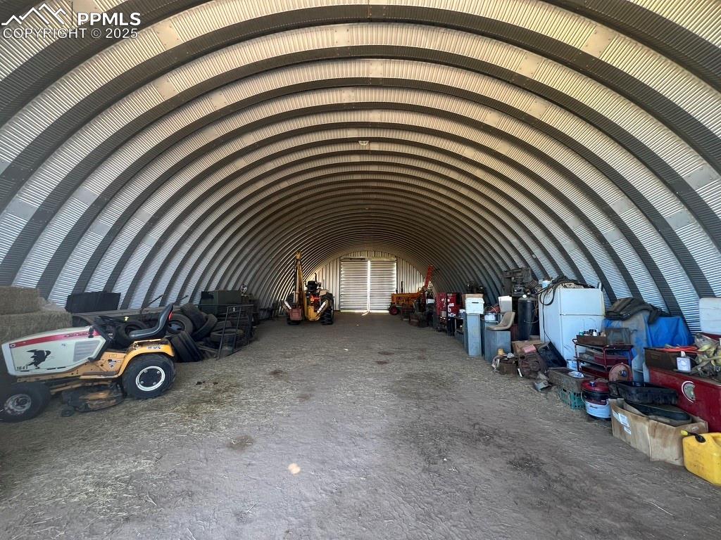 39250 Shear Road Rush, CO 80833 - Photo 8 of 31 a view of a garage with parked cars