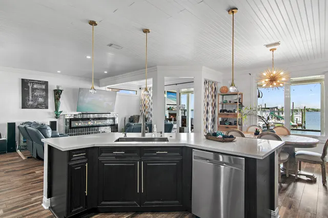 a kitchen with stainless steel appliances granite countertop a stove and refrigerator