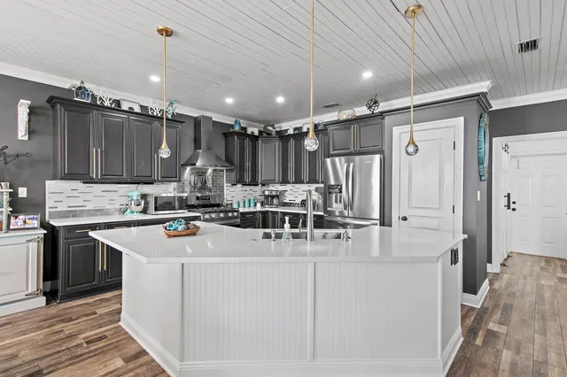 a view of a lake with chairs