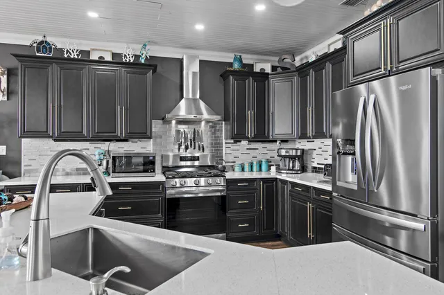 a view of a living room and balcony with furniture