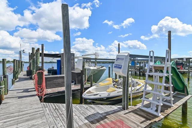 a view of a bathroom with a sink and mirror