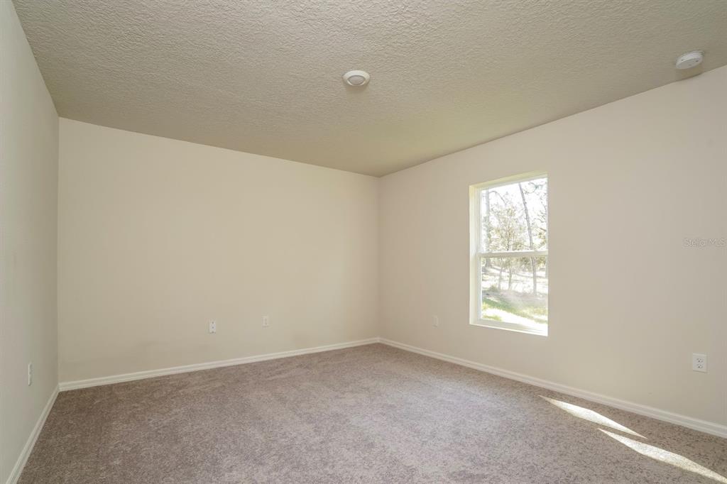 2660 West Bravura Drive Citrus Springs, FL 34433 - Photo 11 of 14 an empty room with windows