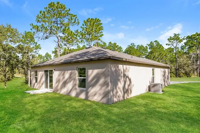 a backyard of a house with lots of green space