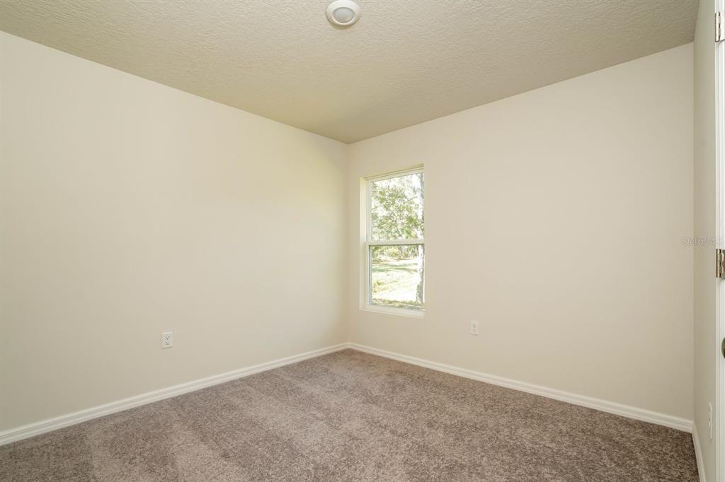 2660 West Bravura Drive Citrus Springs, FL 34433 - Photo 9 of 14 an empty room with windows