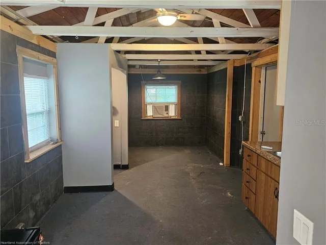 a view of hallway with windows