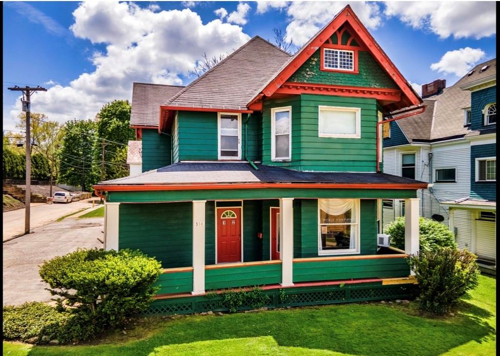 334 East State Street Sharon, PA 16146 - Photo 6 of 19 a front view of a house with a yard