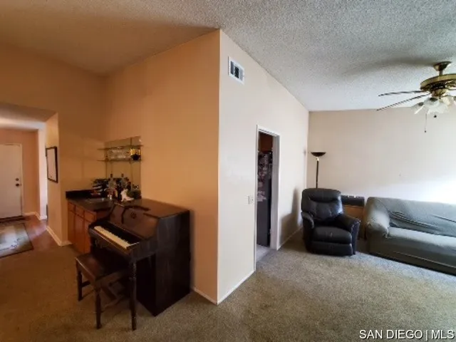5984 Palencia Drive Riverside, CA 92509 - Photo 9 of 16 a living room with furniture and a mirror