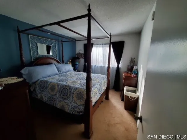 5984 Palencia Drive Riverside, CA 92509 - Photo 10 of 16 a bedroom with a bed next to a window