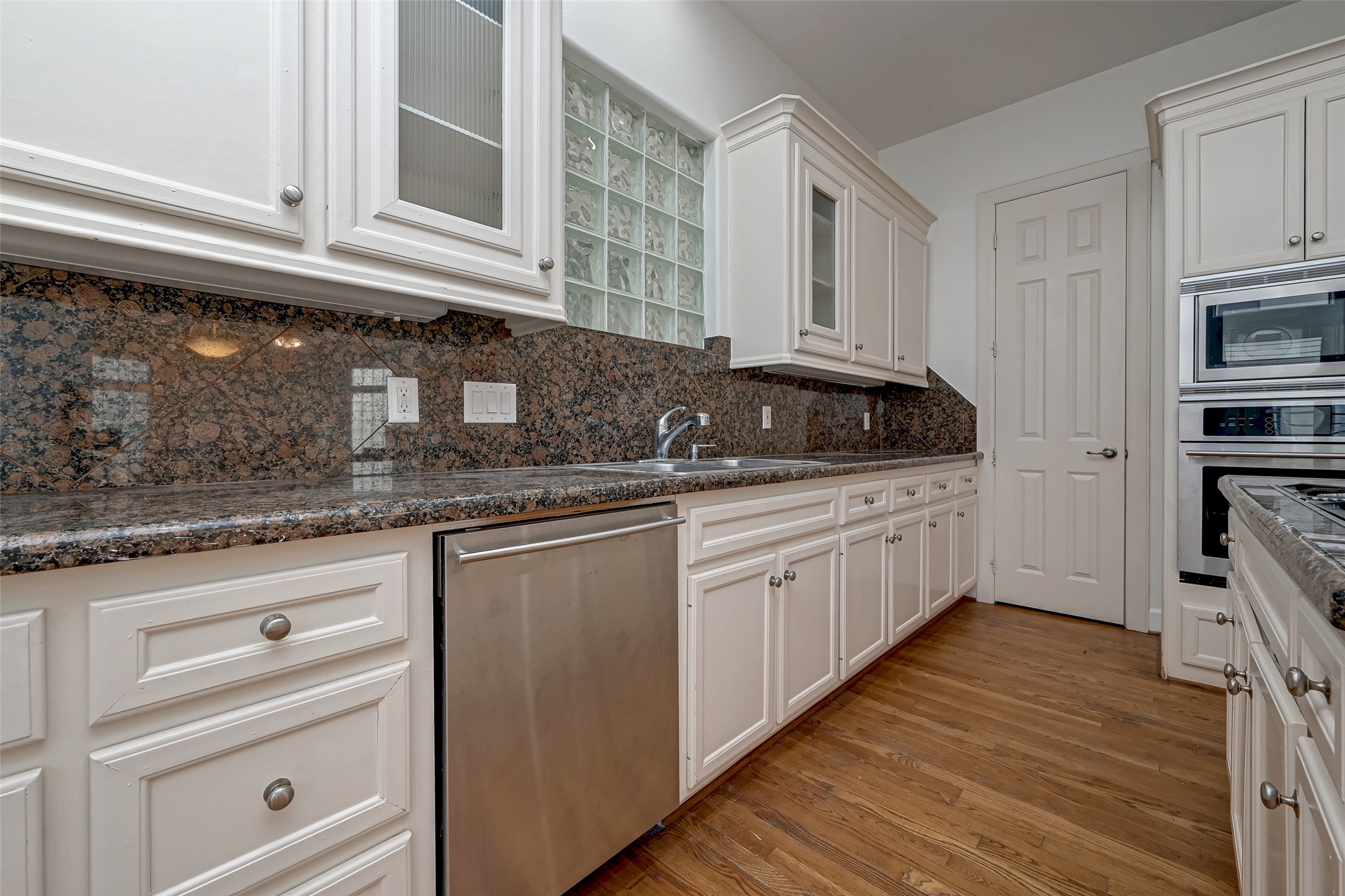 5410 Rose Street Houston, TX 77007 - Photo 21 of 41 a kitchen with stainless steel appliances granite countertop a sink and cabinets