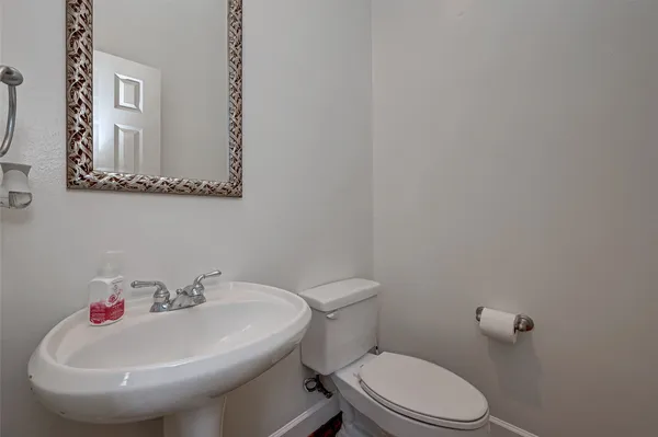 a bathroom with a sink and a toilet
