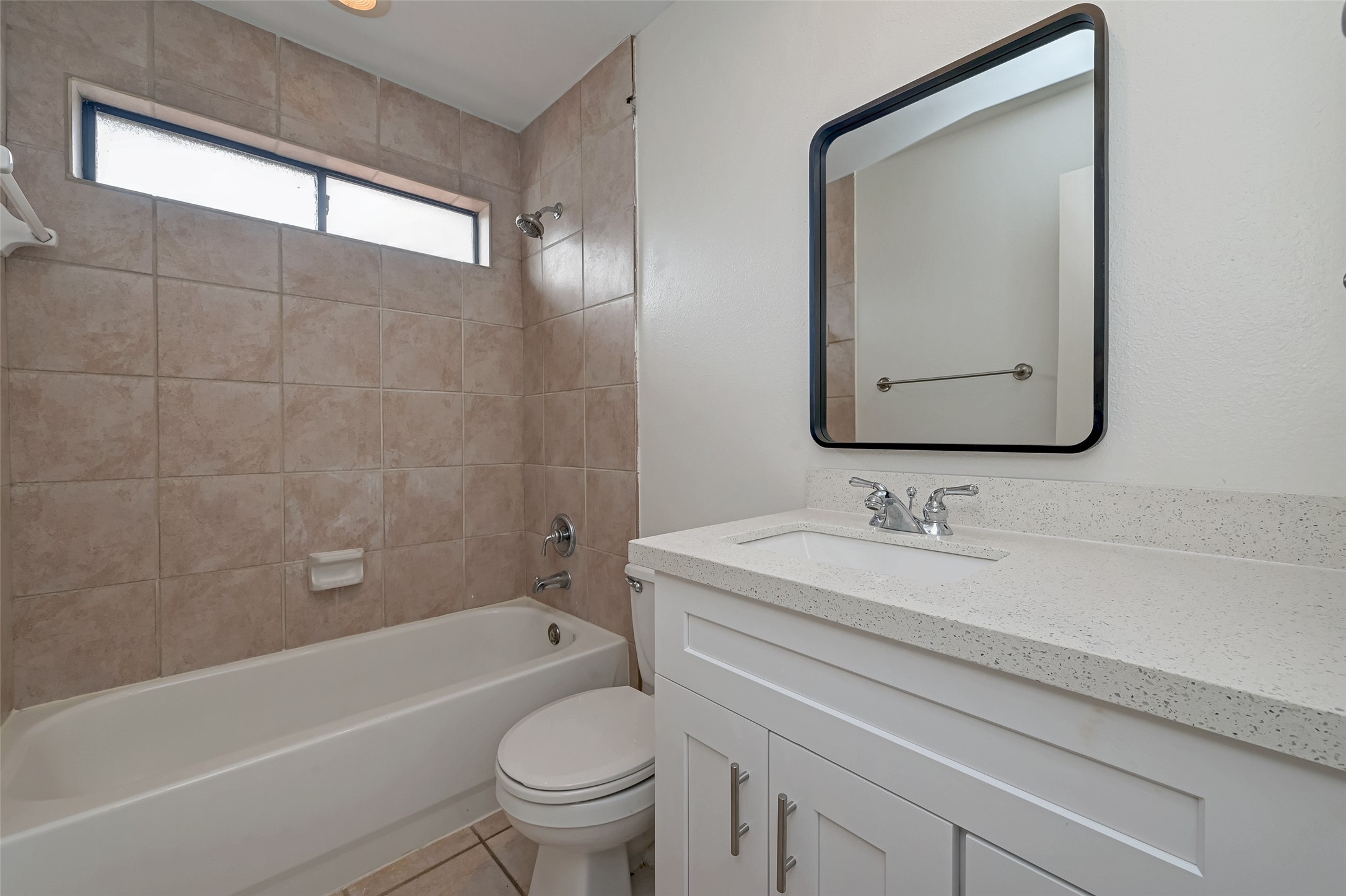 5410 Rose Street Houston, TX 77007 - Photo 38 of 41 a bathroom with a toilet a sink a mirror and bathtub