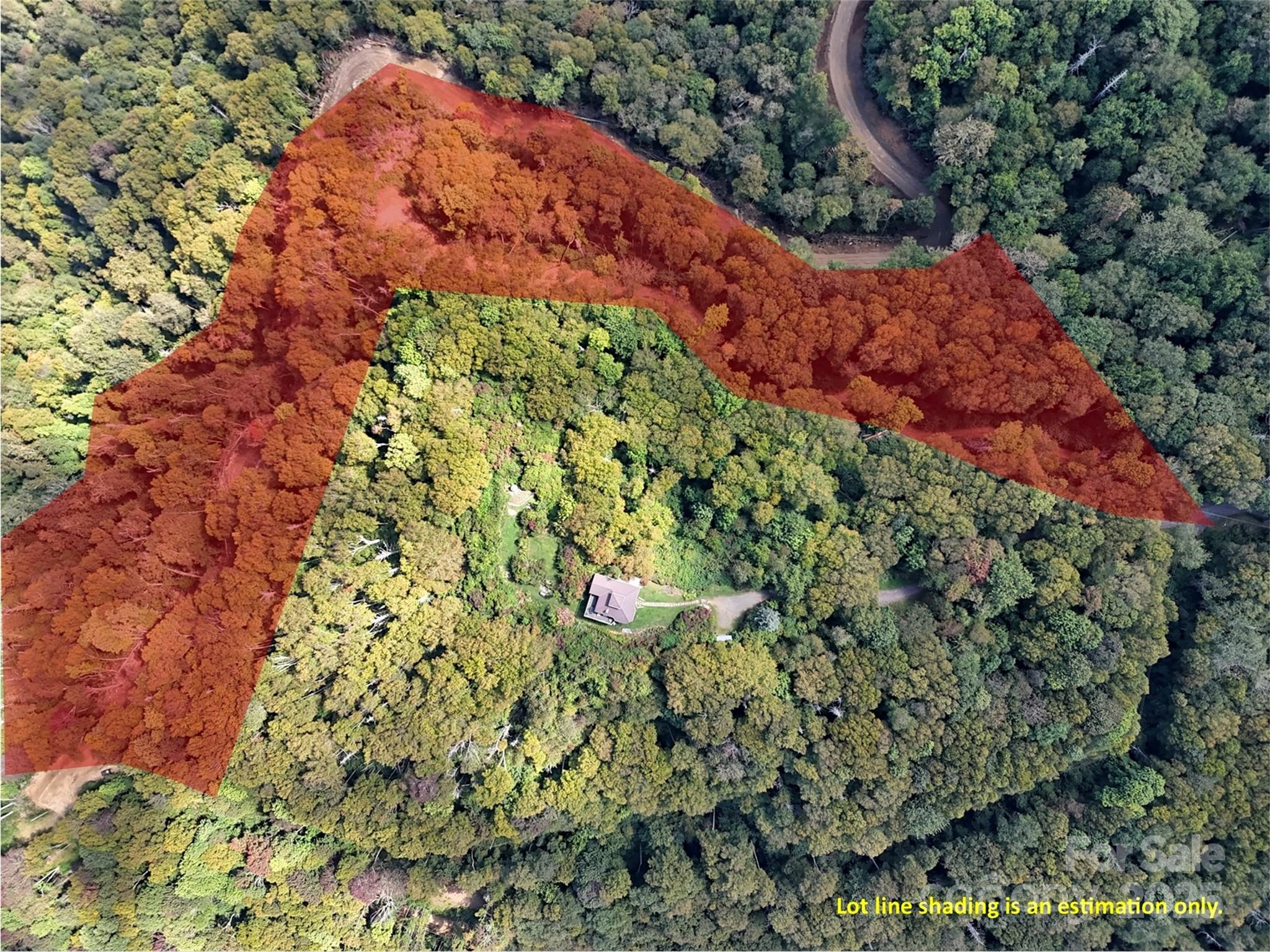 2 Black Rock Road Maggie Valley, NC 28751 - Photo 19 of 19 a backyard of a house with a lot of plants and flowers