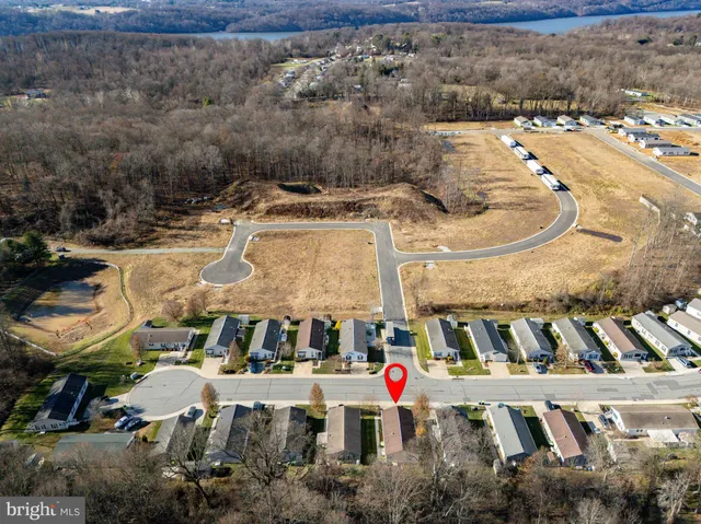 a front view of a house with a yard outdoor seating and garage